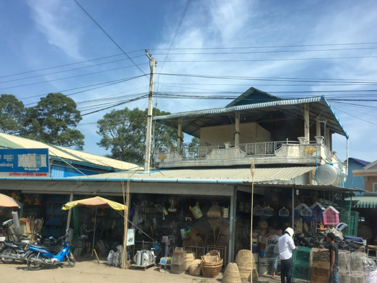 National Road #1.<br>A store has extended over the electricity line and encroaches into ROW.